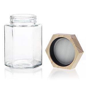 Hexagonal honey jar with wooden lid, 70mm dia.x 239mm h Hexagonal honey jar with wooden lid, 70mm dia.x 239mm h